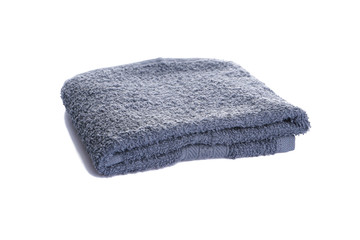 Bath accessories. Hygiene products. Gray bath towel isolated on a white background.