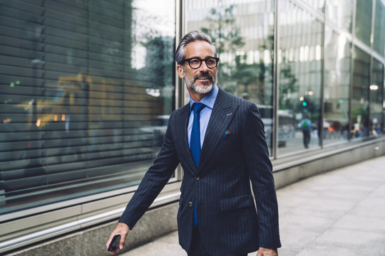 Sophisticated Mature Man Walking On Street