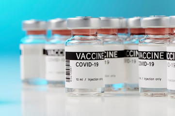 ampoules with Covid-19 vaccine on a laboratory bench. to fight the coronavirus / sars-cov-2...