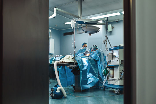 The medical team is preparing the operating room for a complex operation. Modern medicine. A team of professionals - Powered by Adobe