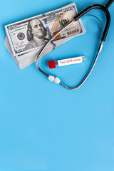 Stethoscope and dollars. Health costs during the epidemic of the coronavirus. Concept of payment for medical services in a crisis covid-19. Concept of analysis of the medical services market