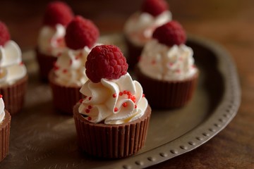 Cup of chocolate with apricot with wipped cream and raspberry