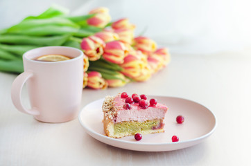 breakfast, holiday, morning with flowers tulips, cake, tea in pink mug on white background. womens, mothers, Valentines Day, birthday. copy space, soft focus