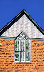 Fototapeta na wymiar Historic church with stained glass window