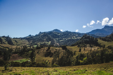 Rolling lush green hills of the Cundinamarca landscape near Choachi, just outside the capital city Bogotá, Colombia