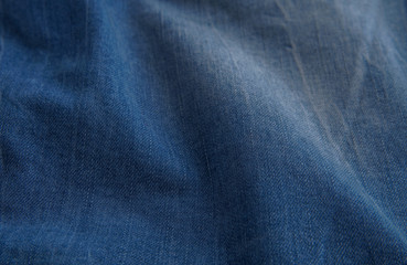 blue denim background with scuffed and creases