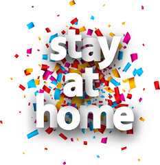 Stay at home sign over confetti background.