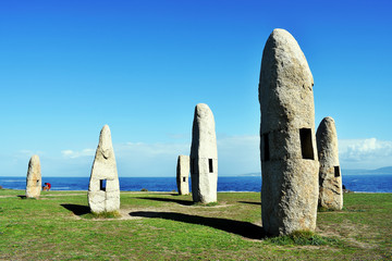 Menhirs of the Sculpture Park of the Tower of Hercules in La Coruña, Galicia. Spain. Europe....
