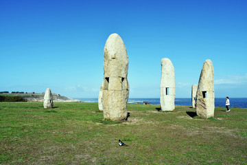 Menhirs of the Sculpture Park of the Tower of Hercules in La Coruña, Galicia. Spain. Europe....