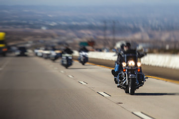 Band of bikers riding on the interstate road, California, group of motorcycles on the Highway, on...