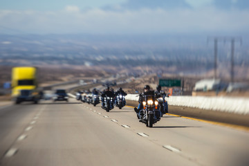 Band of bikers riding on the interstate road, California, group of motorcycles on the Highway, on...