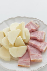 Chopped bacon and potato on dish for cooking ingredient