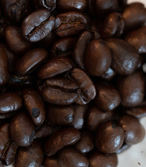 Hole beans of coffee in the macro picture. Roasted dark, brown,  aroma coffee. 