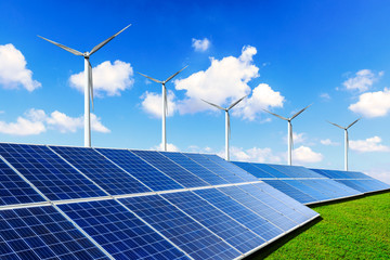 Solar panels with wind turbines on a sunny day,green clean energy concept.