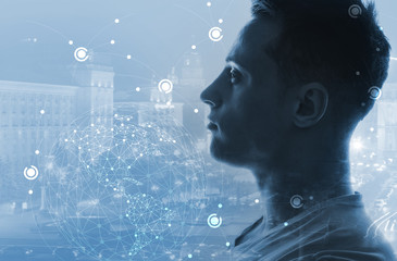 Triple exposure of man, model of Earth and modern city