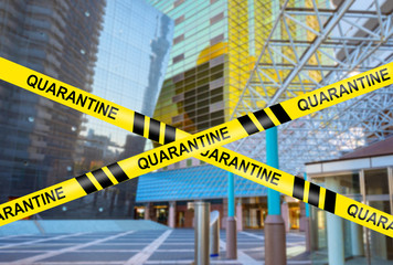 Office buildings are quarantined. A yellow ribbon signals the beginning of quarantine. Entrance to downtown is prohibited. Restrictions on movement due to the virus. Concept - quarantine shutdown.