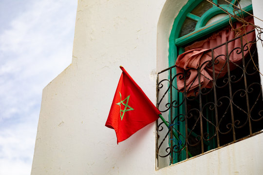 Red morroco Flag in a village