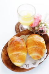 Homemade butter roll bread on wooden plate