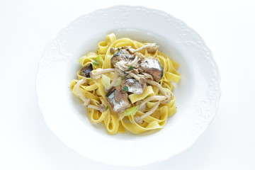 Italian food, sardines and fettuccine pasta
