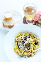 Italian food, sardines and fettuccine pasta
