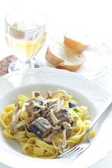 Italian food, sardines and fettuccine pasta
