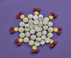 many pills scattered on the table are relevant during the covid-19 pandemic