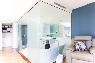 Glass bathroom with timber flooring