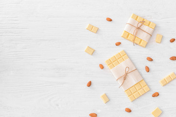 Sweet white chocolate with almond on table