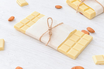 Sweet white chocolate with almond on table