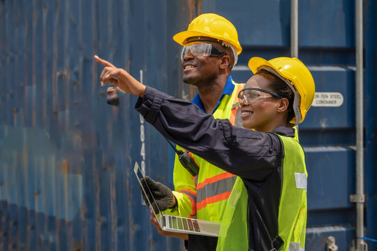 Industrail Background Of African American Containers Yard And Cargo Inspector Team Working At Containers Loading Area