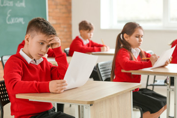 Fototapeta premium Pupils passing exam at school
