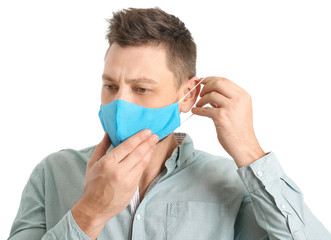 Man in protective medical mask on white background