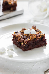 Chocolate brownie cake with marshmallows and nuts