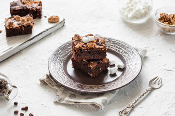Chocolate brownie cake with marshmallows and nuts