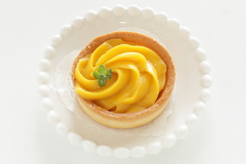 Homemade pumpkin tart with mint