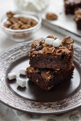 Chocolate brownie cake with marshmallows and nuts