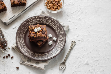 Chocolate brownie cake with marshmallows and nuts