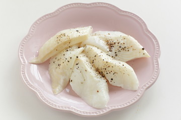 Prepared flat fish and pepper on dish for cooking ingredient