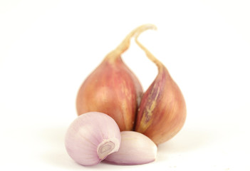 Fresh shallots or onions isolated on white background