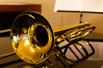 Obraz na płótnie Canvas closeup of tenor trombone on the table