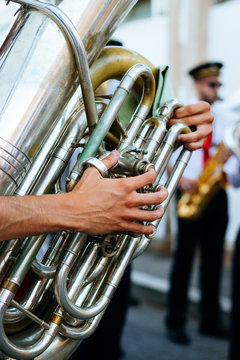 Close up of hand playing tuba