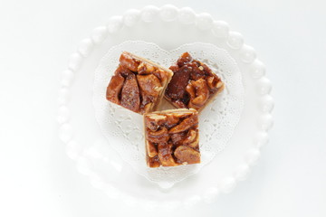 Mixed nuts and cookie on plate with copy space