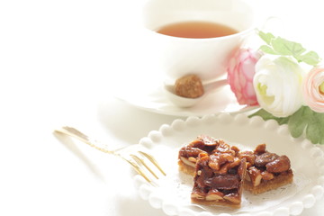 Mixed nuts and cookie on plate with copy space