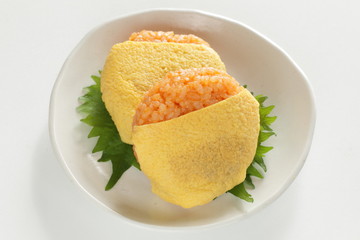 Japanese food, ketchup and wrapped egg rice ball