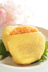 Japanese food, ketchup and wrapped egg rice ball