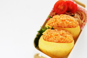 Japanese food, ketchup and wrapped egg rice ball