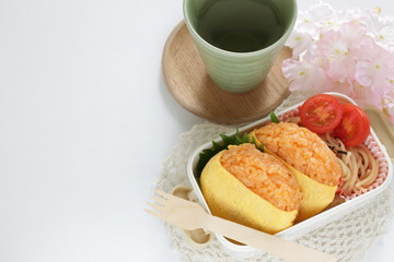 Japanese food, ketchup and wrapped egg rice ball