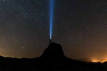light beam in the starry night sky at Trona Pinnacles, California
