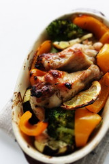 Oven cooking, chicken drumsticks and assorted vegetable