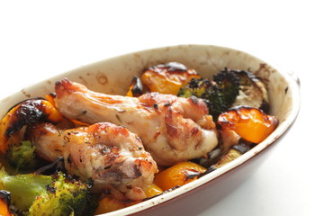 Oven cooking, chicken drumsticks and assorted vegetable